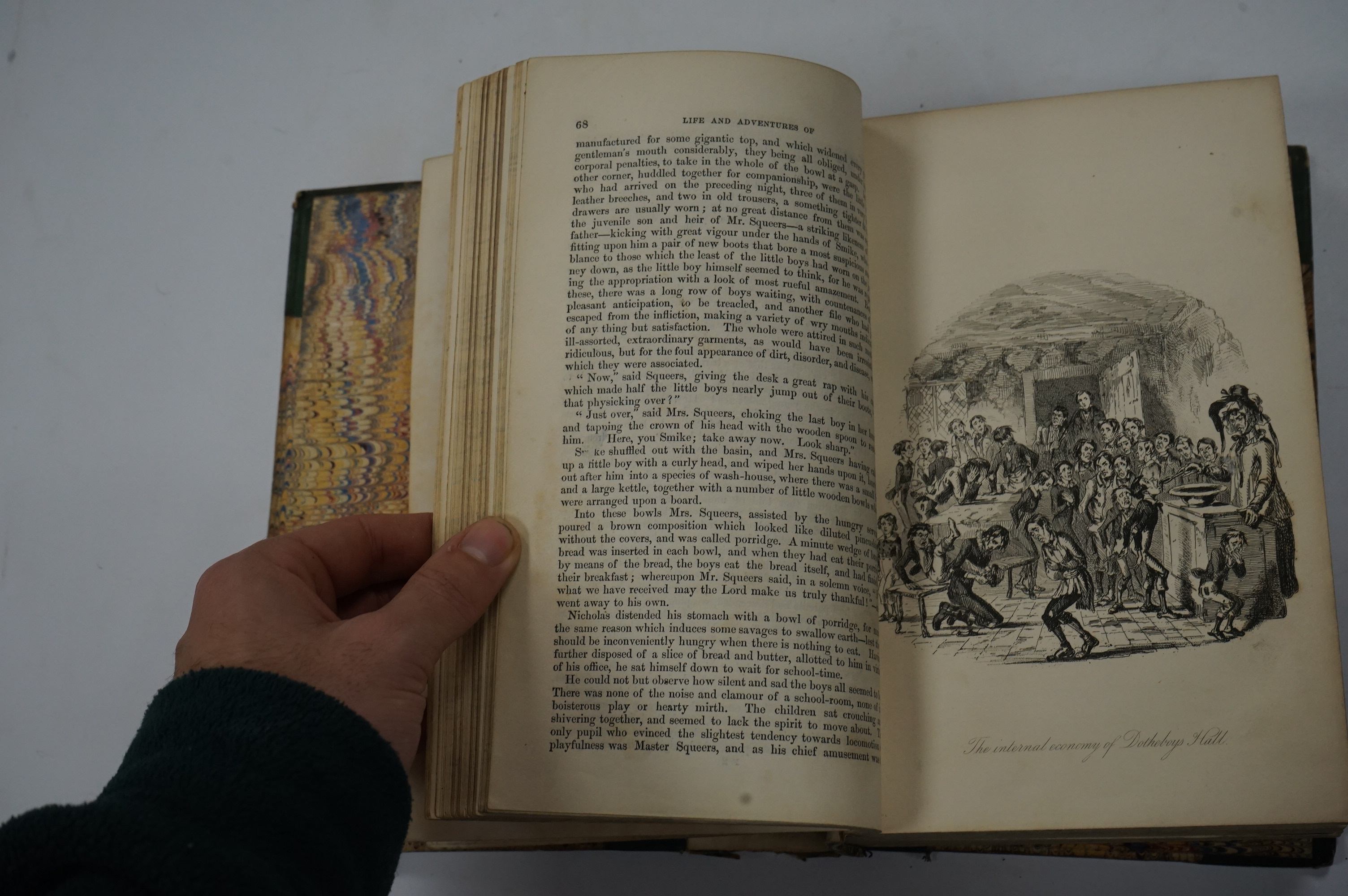 Dickens, Charles - The Life and Adventures of Nicholas Nickleby. First Edition. portrait frontis. of the author, 39 plates (by Phiz, i.e. H.K. Browne); near contemp. half calf and marbled boards, gilt decorated and panel